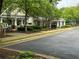 Community clubhouse featuring picnic tables, a playground, and well-maintained landscaping at 143 Ilex Dr, Canton, GA 30114