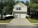 Charming two-story home featuring a two-car garage and well-maintained landscaping at 143 Ilex Dr, Canton, GA 30114