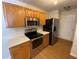 Well-appointed kitchen with stainless steel appliances and light wood cabinetry at 143 Ilex Dr, Canton, GA 30114