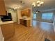 The kitchen and living area features new hardwood floors, neutral paint, and stainless steel appliances at 143 Ilex Dr, Canton, GA 30114