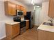This kitchen has stainless steel appliances and light wood cabinets with ample storage at 143 Ilex Dr, Canton, GA 30114