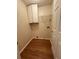 A dedicated laundry room with overhead cabinet and ample space for appliances at 143 Ilex Dr, Canton, GA 30114