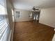 Inviting living room with hardwood floors and plenty of natural light from large windows at 143 Ilex Dr, Canton, GA 30114