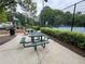 Community picnic area with seating and a playground in the background at 143 Ilex Dr, Canton, GA 30114