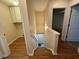 Stairway leading to the basement, featuring a wooden handrail and carpeted steps at 143 Ilex Dr, Canton, GA 30114