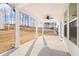 Covered back patio features ceiling fan and concrete floor perfect for outdoor entertaining at 1851 Lacebark Elm Way, Lawrenceville, GA 30045