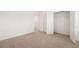 Bedroom with neutral carpet and walk-in closet with closet organizer at 1851 Lacebark Elm Way, Lawrenceville, GA 30045