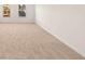 Bedroom featuring neutral colored carpet and ample natural light through two windows at 1851 Lacebark Elm Way, Lawrenceville, GA 30045