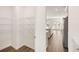 Walk-in pantry features wire shelving and hardwood floors, leading to a modern, eat-in kitchen at 1851 Lacebark Elm Way, Lawrenceville, GA 30045