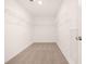 Walk-in closet with carpet, wire shelving, and overhead lighting at 1851 Lacebark Elm Way, Lawrenceville, GA 30045