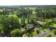 Aerial view showcasing the property's location amidst lush greenery near a golf course at 4379 Bonaparte Dr, Tucker, GA 30084