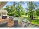 Relaxing wood deck with grill, seating and a beautiful view of the golf course and yard at 4379 Bonaparte Dr, Tucker, GA 30084