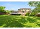 Large, well-maintained backyard with lush green grass and mature trees at 4379 Bonaparte Dr, Tucker, GA 30084