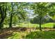 Tranquil backyard space complete with golf course view and room for relaxing at 4379 Bonaparte Dr, Tucker, GA 30084