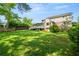 Beautiful backyard with a view of the house, with its back deck, and large grassy area at 4379 Bonaparte Dr, Tucker, GA 30084