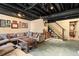 Finished basement features comfortable seating and access to the staircase at 4379 Bonaparte Dr, Tucker, GA 30084