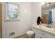Neutral bathroom with a window offering natural light, a pedestal sink and tiled shower at 4379 Bonaparte Dr, Tucker, GA 30084