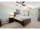 Bedroom with carpeting, a bed with drawers, a ceiling fan, and windows at 4379 Bonaparte Dr, Tucker, GA 30084