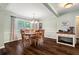 Dining room with hardwood floors, chandelier, and natural light through large windows at 4379 Bonaparte Dr, Tucker, GA 30084
