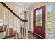 Foyer featuring hardwood floors, staircase, and a red front door with sidelights at 4379 Bonaparte Dr, Tucker, GA 30084