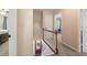 Upstairs hallway featuring a view of the front door and hardwood flooring at 4379 Bonaparte Dr, Tucker, GA 30084