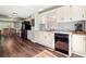 Traditional kitchen with white cabinets, stainless steel appliances, and hardwood flooring at 4379 Bonaparte Dr, Tucker, GA 30084