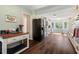 Spacious kitchen with an island, white cabinets, hardwood flooring and stainless appliances at 4379 Bonaparte Dr, Tucker, GA 30084