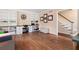 Living room featuring hardwood floors, built-in bookshelves, and a work area at 4379 Bonaparte Dr, Tucker, GA 30084