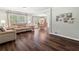Open-concept living room with hardwood flooring connecting to the dining area at 4379 Bonaparte Dr, Tucker, GA 30084