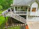 Multi-level backyard deck with stairs to the garage offers outdoor living and entertainment space at 827 Pinehurst Dr, Woodstock, GA 30188