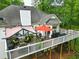 Wide view of the deck, showcasing its size, multiple seating areas, and outdoor cooking space with grills at 827 Pinehurst Dr, Woodstock, GA 30188