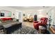 Bright living room boasts modern decor, a comfortable sofa, and a stylish rug at 827 Pinehurst Dr, Woodstock, GA 30188