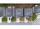 Aerial view of a house highlighting its rectangular shape, driveway, and position between two similar homes at 891 Channel Dr, Lawrenceville, GA 30046
