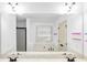 Bright bathroom featuring double vanity, large mirror, and soaking tub at 891 Channel Dr, Lawrenceville, GA 30046
