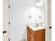 Bright, minimalist bathroom featuring a vanity with a modern sink and mirror at 891 Channel Dr, Lawrenceville, GA 30046