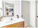 Bathroom vanity with light wood cabinets and white countertop at 891 Channel Dr, Lawrenceville, GA 30046