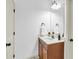 Bright, minimalist bathroom featuring a vanity with a modern sink and mirror at 891 Channel Dr, Lawrenceville, GA 30046