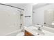 Bathroom featuring tub/shower combo and single sink vanity at 891 Channel Dr, Lawrenceville, GA 30046