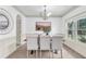 Elegant dining room with modern lighting and ample natural light at 891 Channel Dr, Lawrenceville, GA 30046