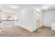 Bright carpeted upper hallway with classic white doors and neutral walls at 891 Channel Dr, Lawrenceville, GA 30046