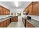 Well-equipped kitchen with granite countertops, stainless steel appliances, and ample cabinet space at 891 Channel Dr, Lawrenceville, GA 30046