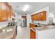 Bright, open kitchen featuring a large island, granite countertops, and stainless steel appliances at 891 Channel Dr, Lawrenceville, GA 30046