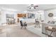 Bright living room with open layout, connecting to kitchen and dining areas at 891 Channel Dr, Lawrenceville, GA 30046