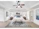A serene main bedroom featuring a tray ceiling, carpet, and matching nightstands at 891 Channel Dr, Lawrenceville, GA 30046