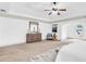 Large primary bedroom with sitting area, large mirror, and an arch window at 891 Channel Dr, Lawrenceville, GA 30046
