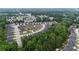 An aerial view of a planned community nestled amongst lush green trees at 891 Channel Dr, Lawrenceville, GA 30046