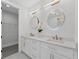 Elegant bathroom featuring double sinks, illuminated mirrors and modern fixtures at 101 Fairfield Ct, Atlanta, GA 30314