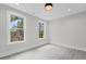 Clean, bright bedroom with hard surface floors and two windows provides ample natural light at 101 Fairfield Ct, Atlanta, GA 30314