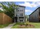 Charming two-story home featuring a modern design and beautifully landscaped front yard with a nice walkway at 101 Fairfield Ct, Atlanta, GA 30314