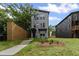Inviting two-story home with modern architectural details and a well-maintained front lawn and wooden fence at 101 Fairfield Ct, Atlanta, GA 30314